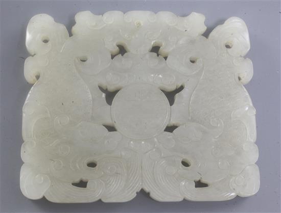 A Chinese white jade plaque, 18th / 19th century, 6.7cm, later wood stand